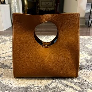 Unique textured leather handbag with suede interior. never been carried